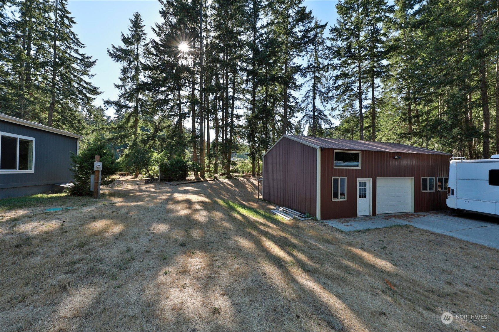 2811 East Andreason Road Langley, WA 98260 - Photo 9 of 38 a view of a house with a yard