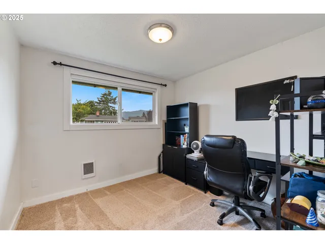 a workspace with furniture and window