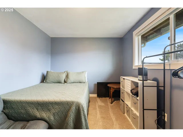 a bedroom with a bed and cabinets