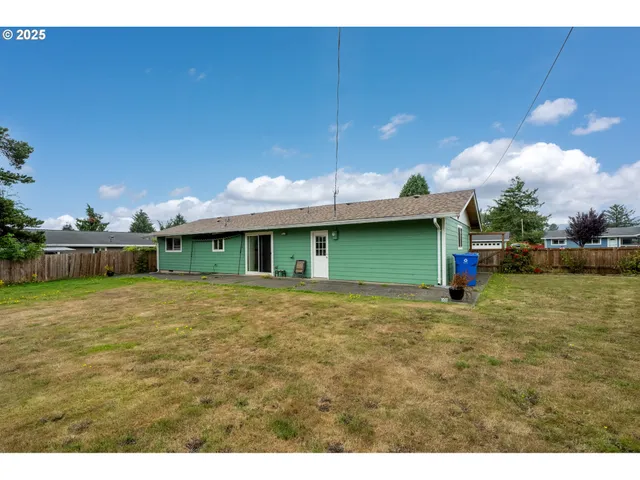 a view of a couches in front of house and swimming pool
