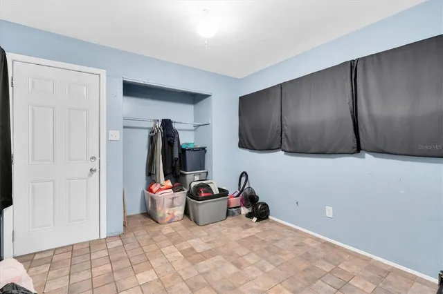 a view of a livingroom with storage and utility