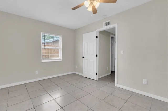 a view of an empty room with a window
