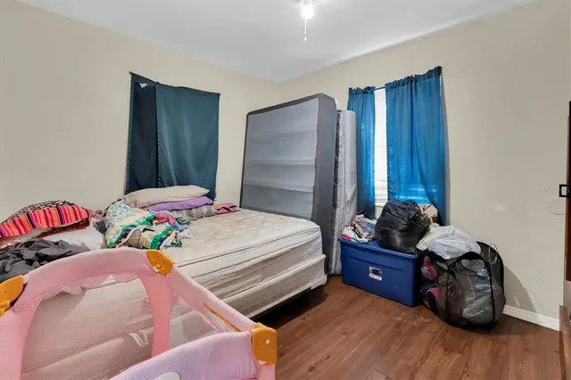 a bedroom with two beds and a closet