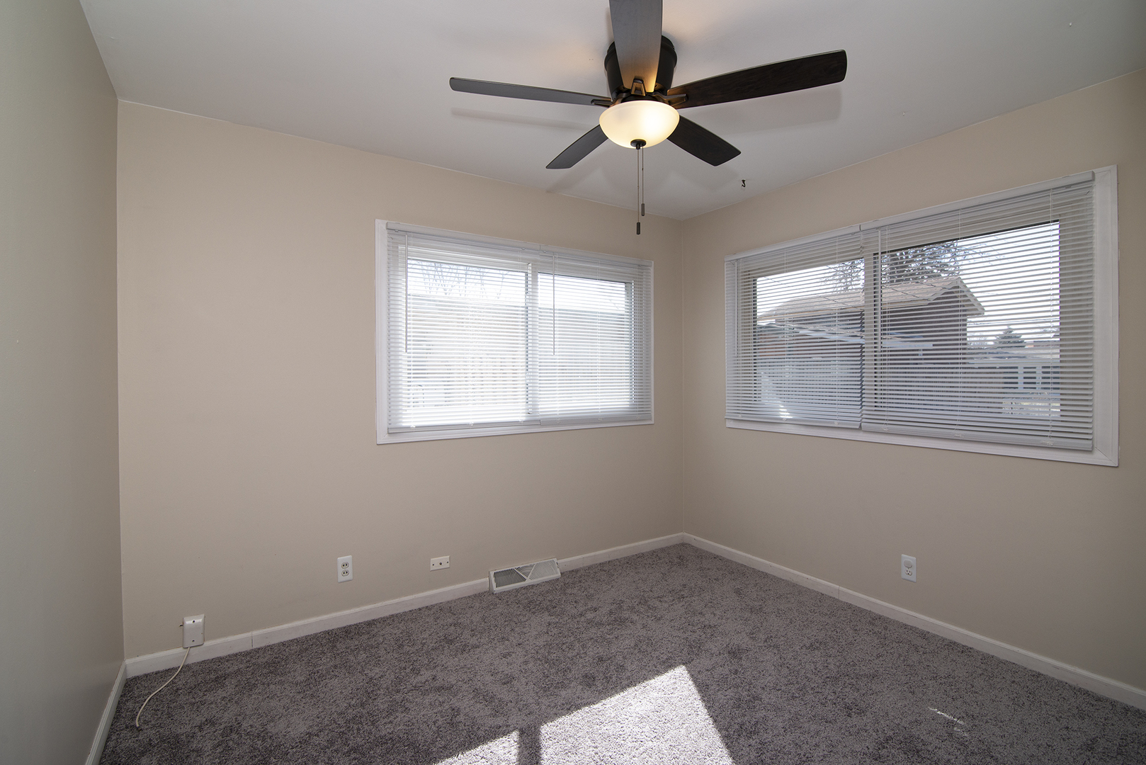 37 Durango Road Montgomery, IL 60538 - Photo 17 of 27 en empty room with windows and ceiling fan
