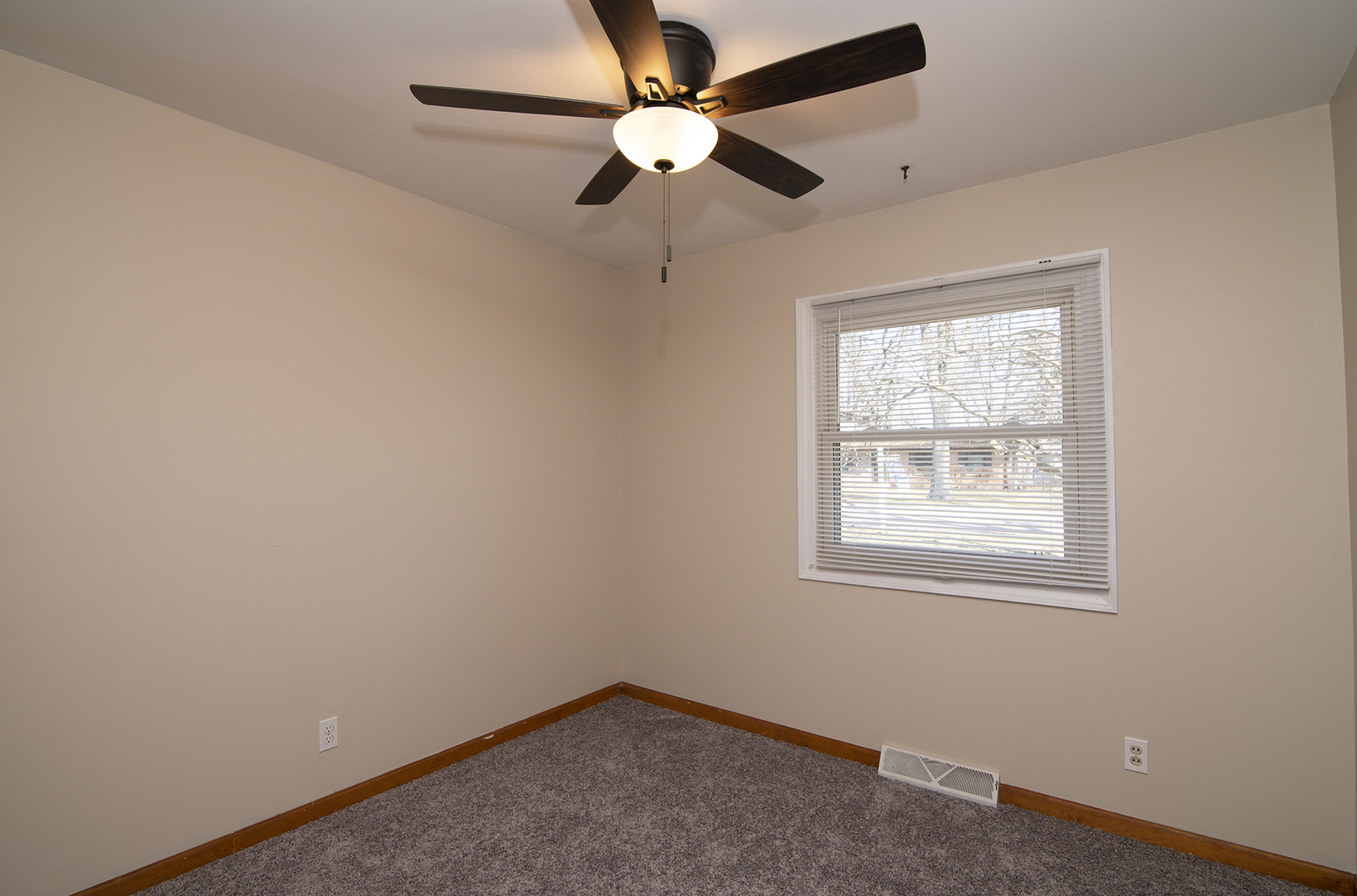 37 Durango Road Montgomery, IL 60538 - Photo 19 of 27 an empty room with a window and a fan