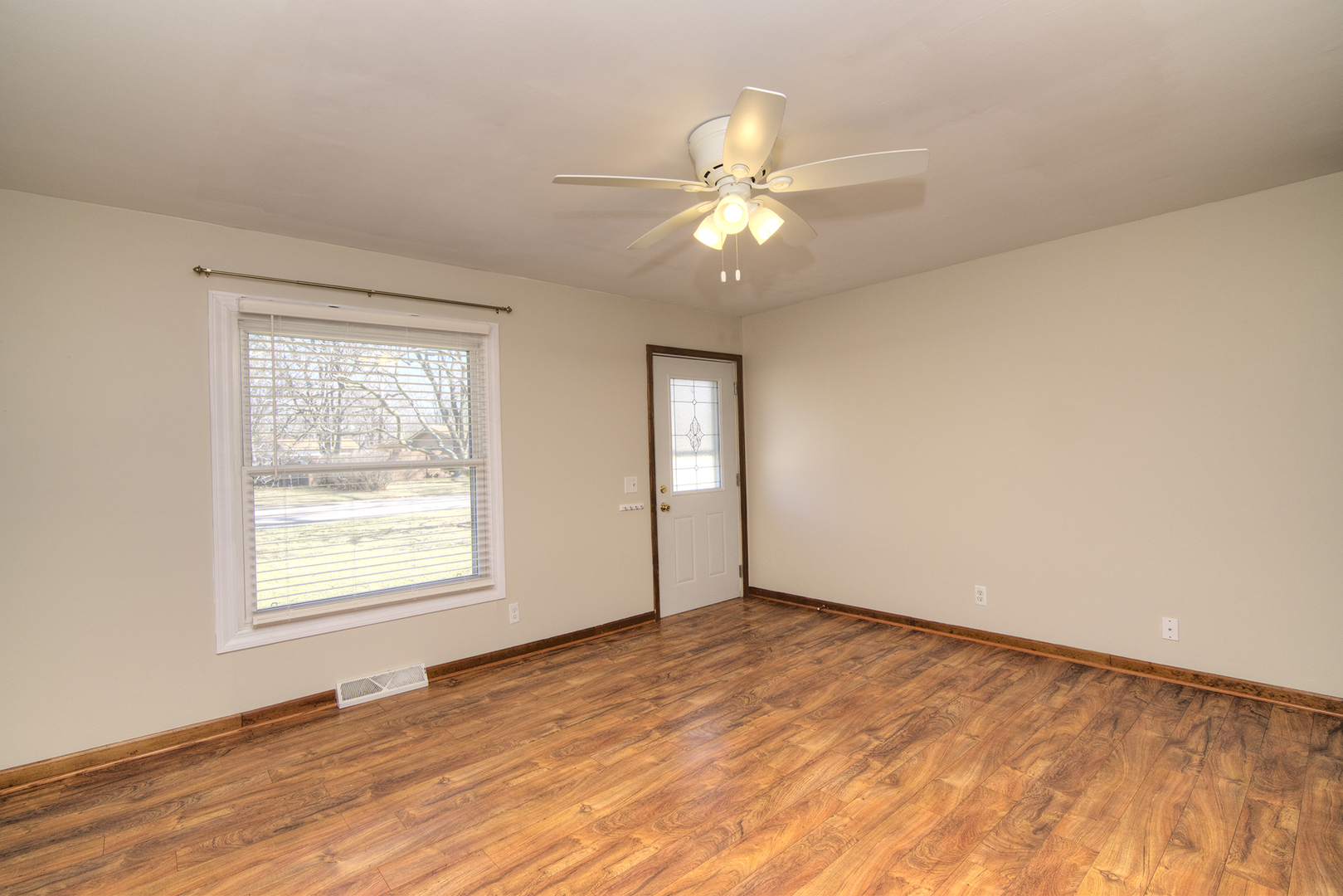37 Durango Road Montgomery, IL 60538 - Photo 4 of 27 wooden floor in an empty room with a window