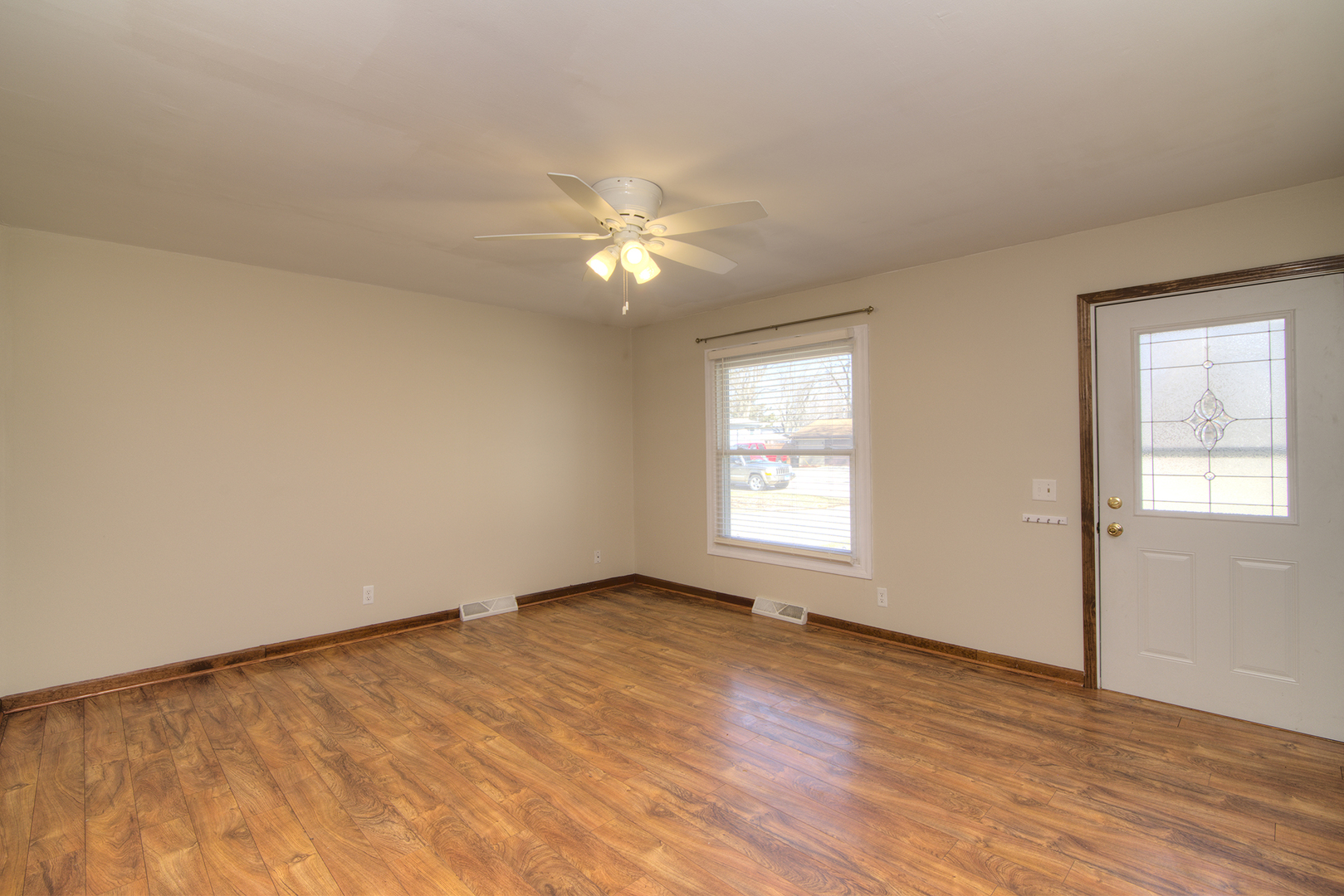37 Durango Road Montgomery, IL 60538 - Photo 5 of 27 a view of empty room with wooden floor and fan
