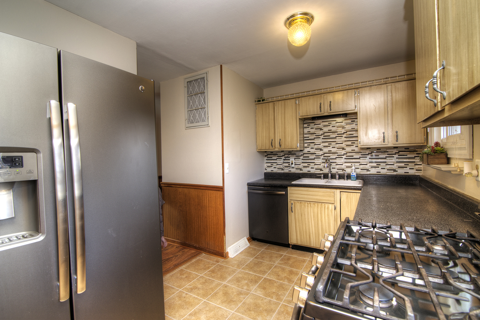 37 Durango Road Montgomery, IL 60538 - Photo 8 of 27 a kitchen with granite countertop a stove and a refrigerator