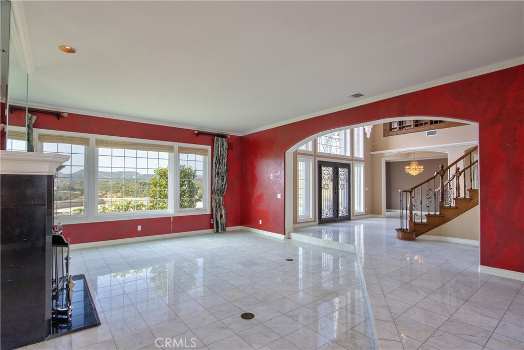 46856 El Prado Road Temecula, CA 92590 - Photo 19 of 75 a view of a big room with windows and chandelier