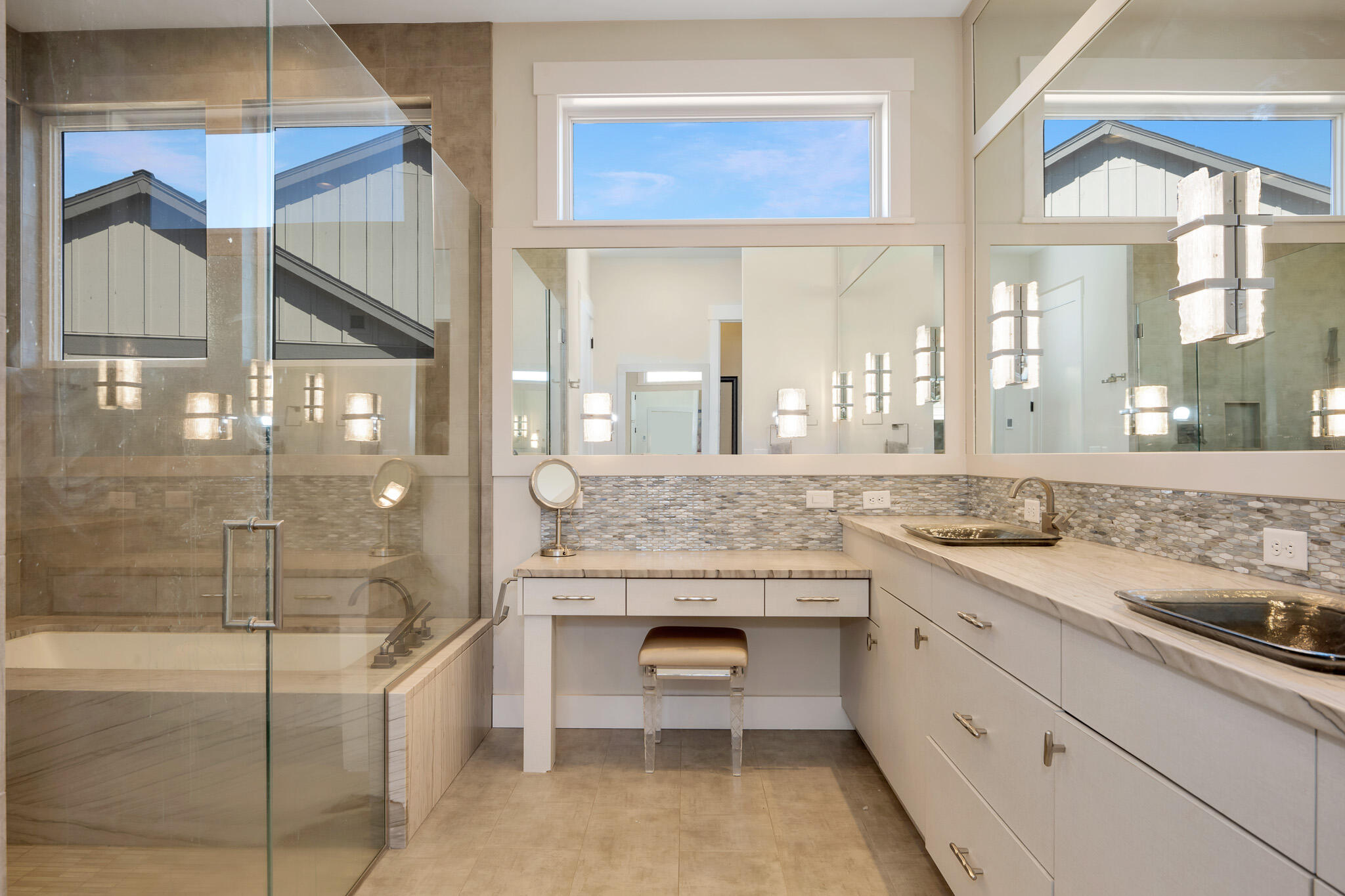 60871 River Rim Drive Bend, OR 97702 - Photo 28 of 42 a bathroom with a granite countertop sink mirror and bathtub