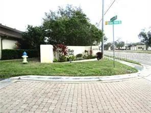 a view of a fountain in front of a house