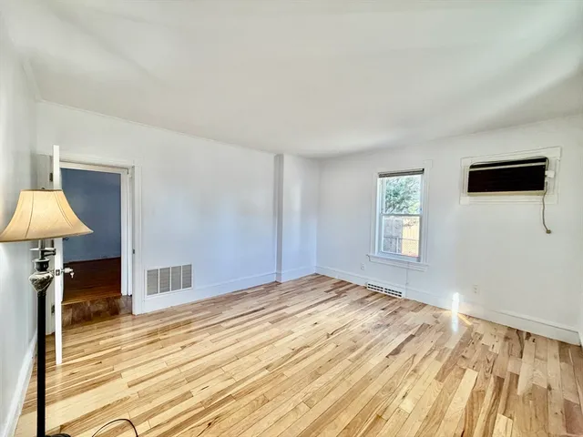 a bedroom with a bed and a ceiling fan