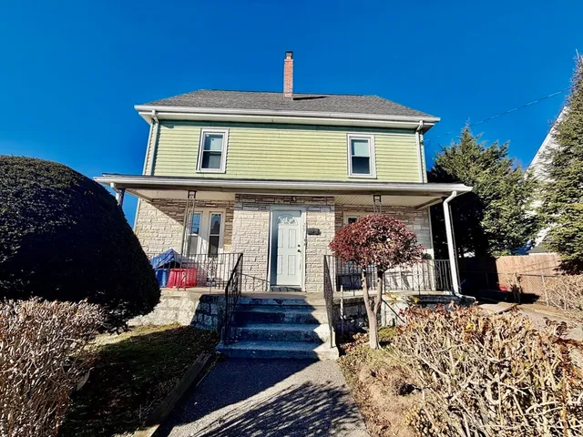 a front view of a house with a porch