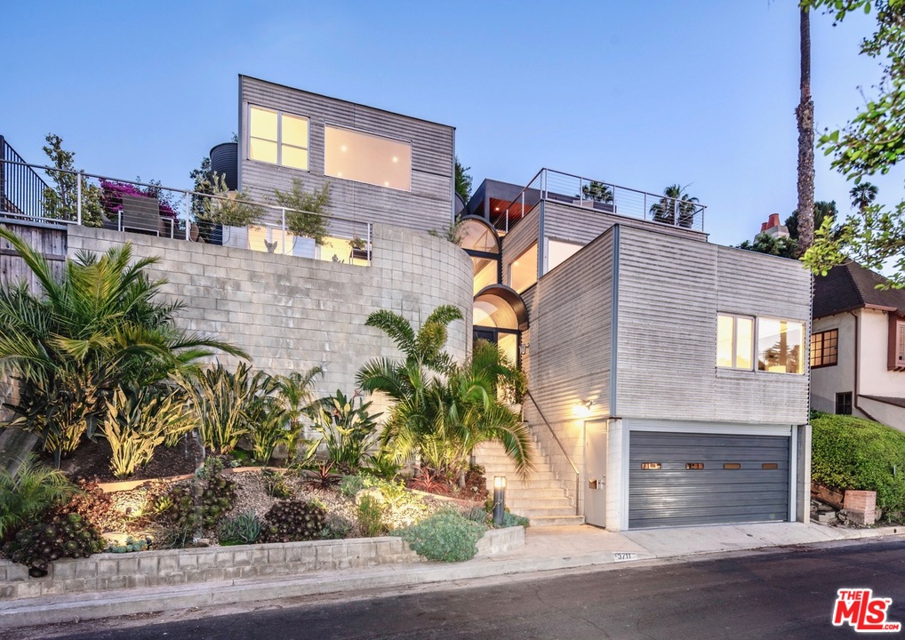 3711 Prestwick Drive Los Angeles, CA 90027 - Photo 1 of 37 a front view of a house with a yard