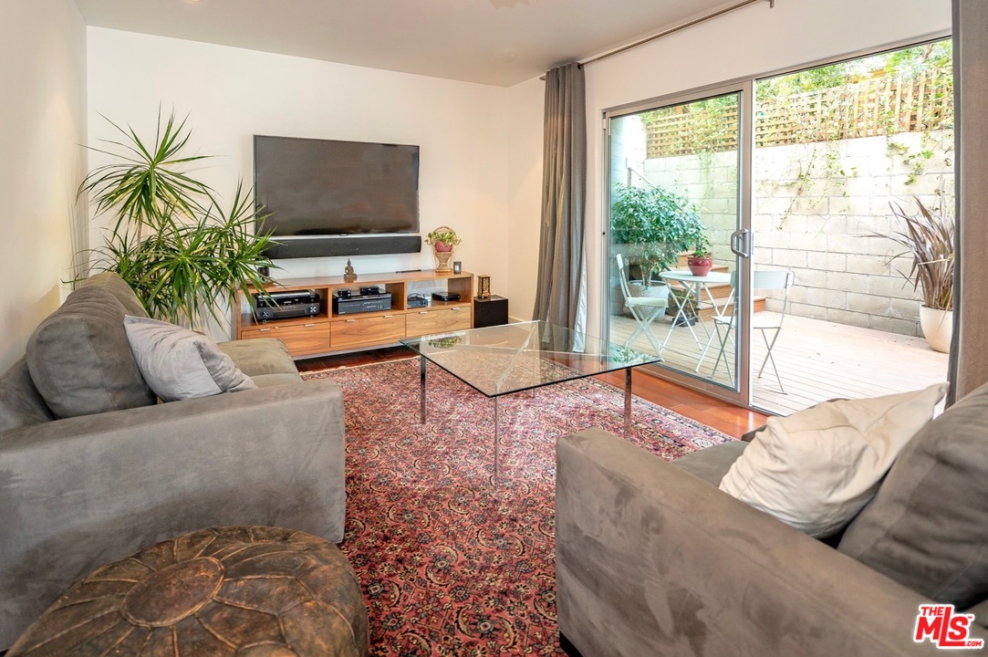3711 Prestwick Drive Los Angeles, CA 90027 - Photo 16 of 37 a living room with furniture and a flat screen tv