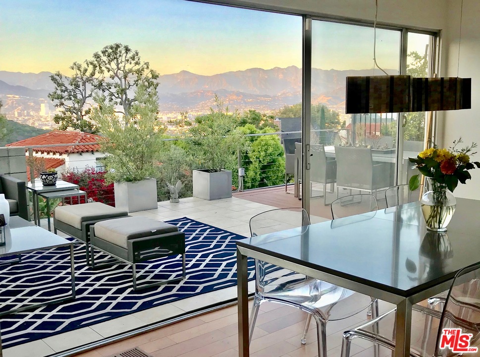 3711 Prestwick Drive Los Angeles, CA 90027 - Photo 3 of 37 a view of a patio with a table chairs and a potted plant
