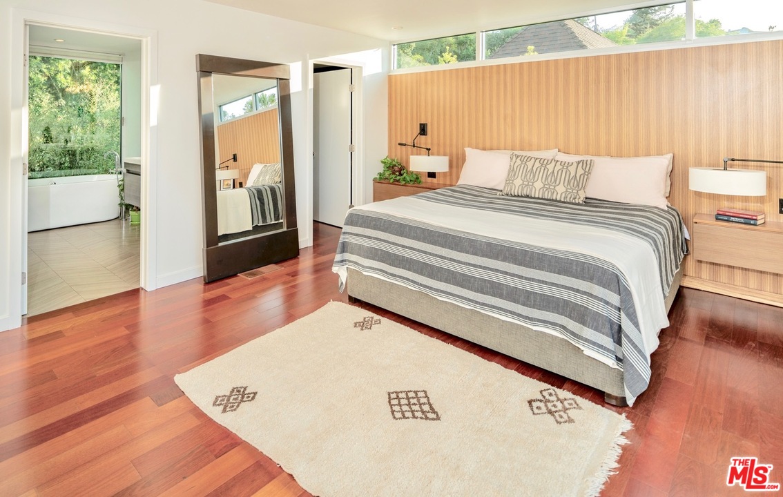 3711 Prestwick Drive Los Angeles, CA 90027 - Photo 21 of 37 a bedroom with a bed and wooden floor