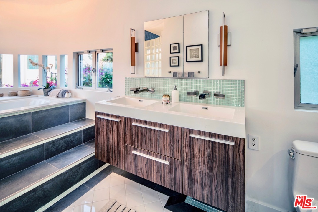 3711 Prestwick Drive Los Angeles, CA 90027 - Photo 26 of 37 a kitchen with a sink and a stove with wooden floor