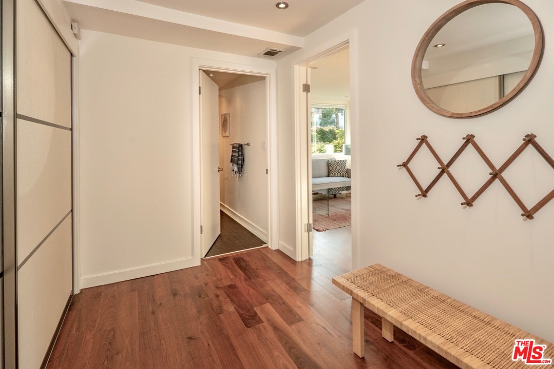 3711 Prestwick Drive Los Angeles, CA 90027 - Photo 27 of 37 a view of a livingroom with wooden floor and a hallway