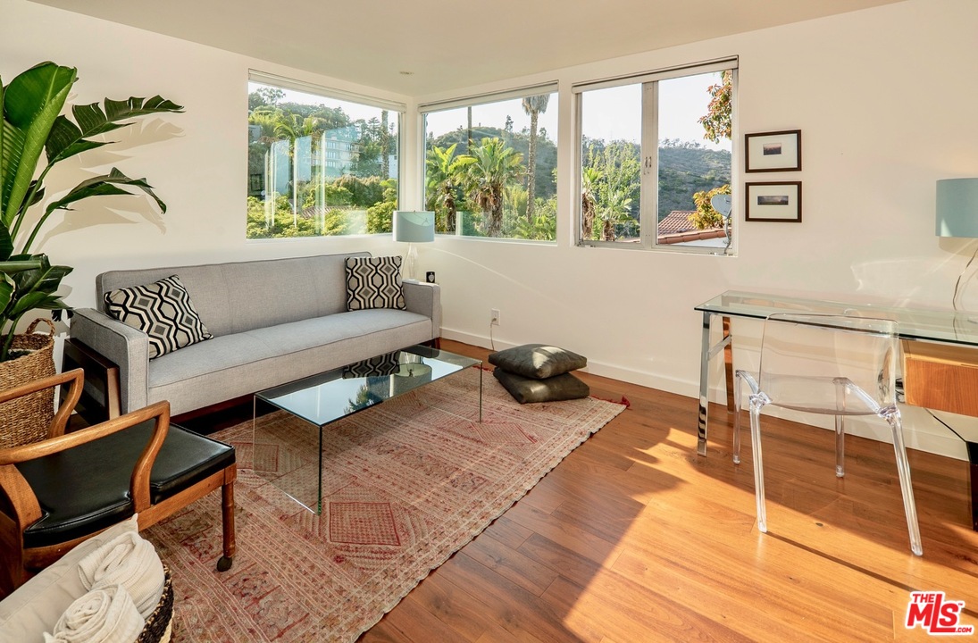3711 Prestwick Drive Los Angeles, CA 90027 - Photo 28 of 37 a living room with furniture and a large window