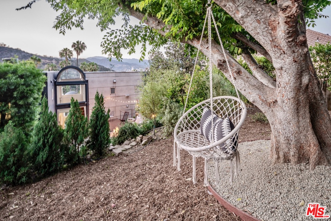 3711 Prestwick Drive Los Angeles, CA 90027 - Photo 34 of 37 a view of a chair and table in the backyard