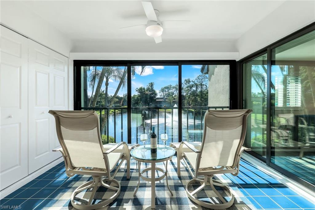 1672 Spoonbill Lane, Unit B Naples, FL 34105 - Photo 20 of 41 a view of a dining room with furniture window and wooden floor
