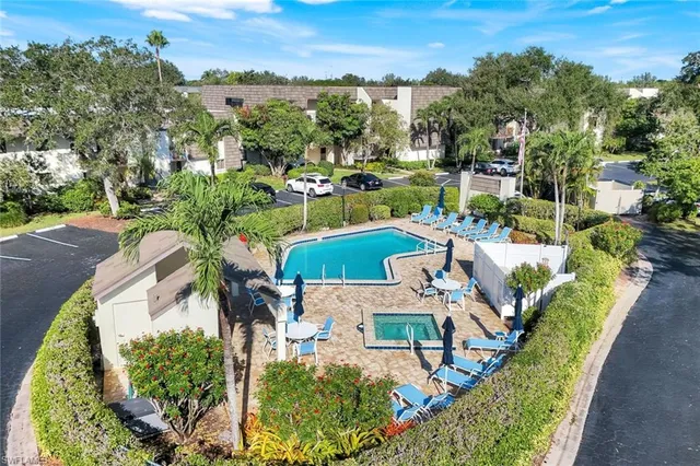 an aerial view of a house with outdoor space swimming pool patio and mountain view