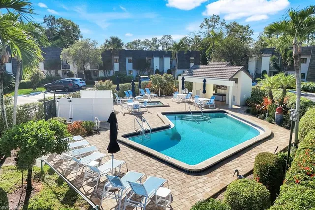 a view of a backyard with sitting area and furniture