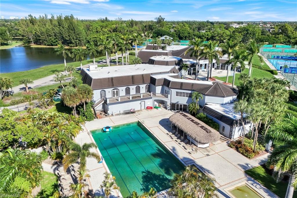 1672 Spoonbill Lane, Unit B Naples, FL 34105 - Photo 34 of 41 an aerial view of a house with a garden and lake view