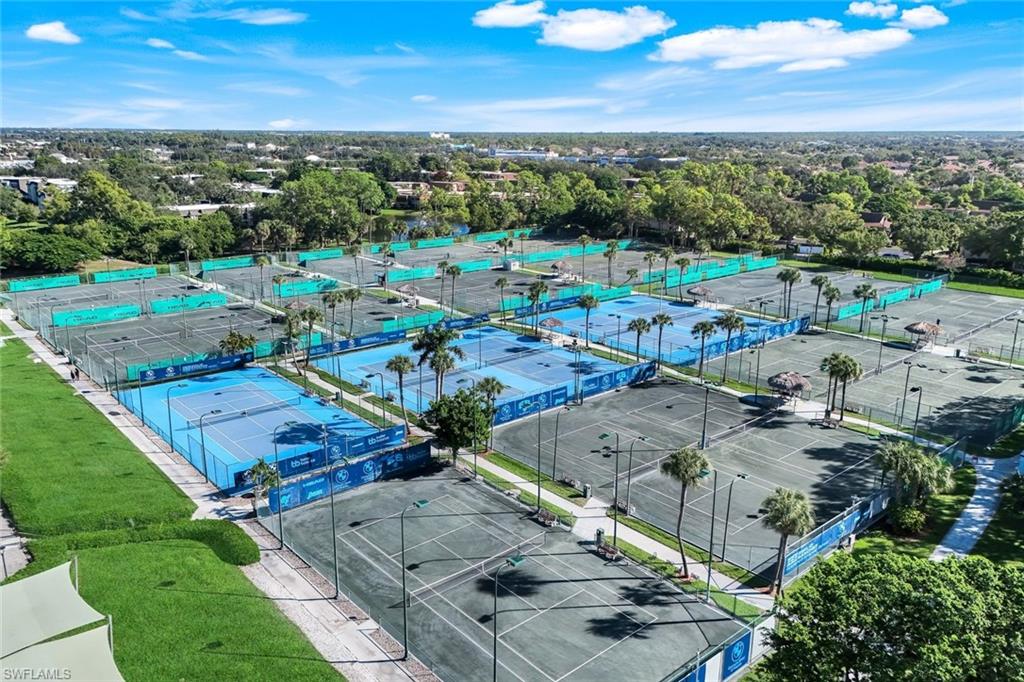 1672 Spoonbill Lane, Unit B Naples, FL 34105 - Photo 36 of 41 an aerial view of a city with lots of residential buildings ocean and mountain view in back