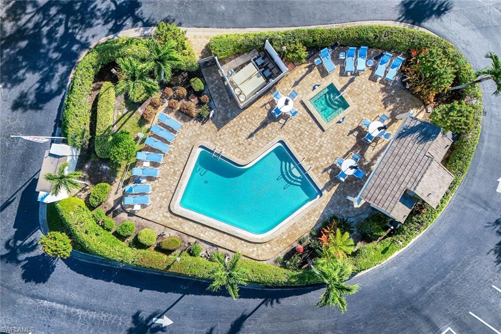 1672 Spoonbill Lane, Unit B Naples, FL 34105 - Photo 40 of 41 an aerial view of a house with a garden and swimming pool