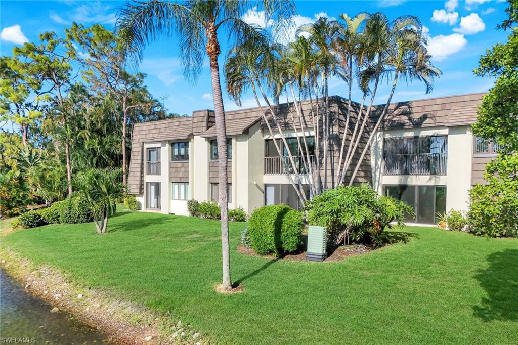 1672 Spoonbill Lane, Unit B Naples, FL 34105 - Photo 41 of 41 a view of a yard in front of house