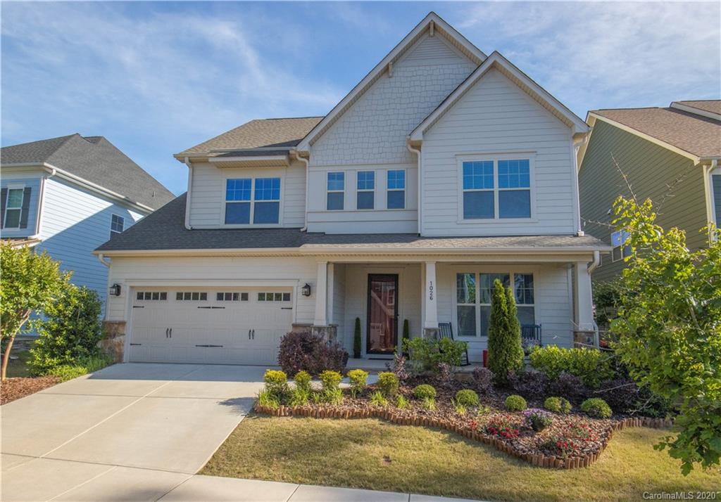 1026 Emory Lane Fort Mill, SC 29708 - Photo 1 of 41 a front view of a house with a yard garage and outdoor seating