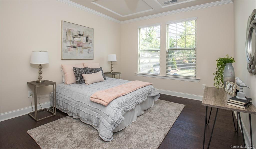 1026 Emory Lane Fort Mill, SC 29708 - Photo 13 of 41 a bedroom with a bed and a potted plant on the dresser
