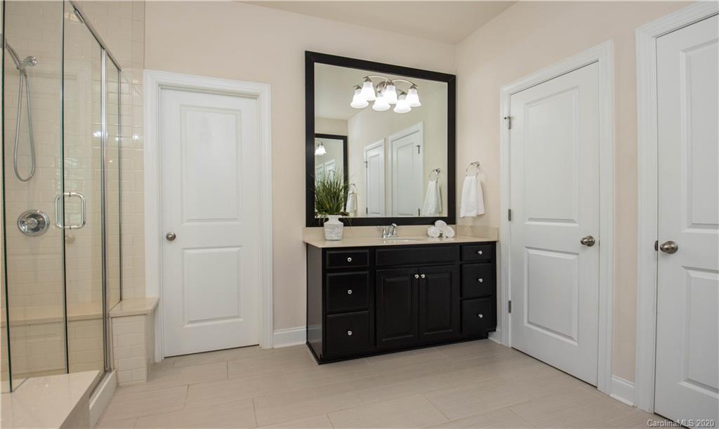 1026 Emory Lane Fort Mill, SC 29708 - Photo 16 of 41 a bathroom with a double vanity sink and mirror