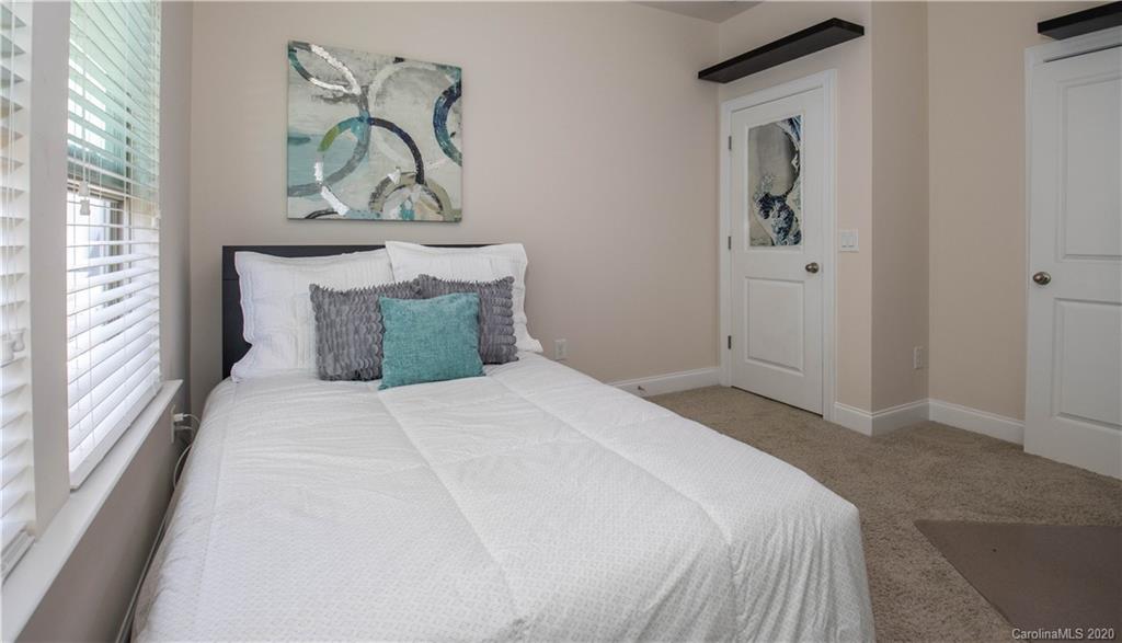 1026 Emory Lane Fort Mill, SC 29708 - Photo 18 of 41 a bedroom with a bed and painting on the wall