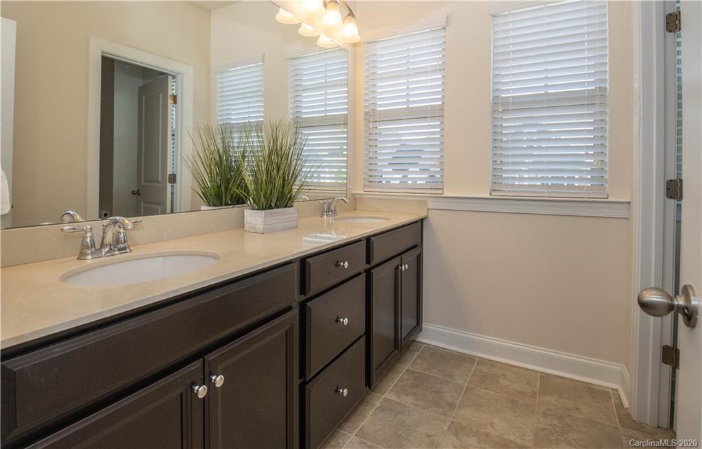 1026 Emory Lane Fort Mill, SC 29708 - Photo 21 of 41 a bathroom with a granite countertop sink and a large mirror