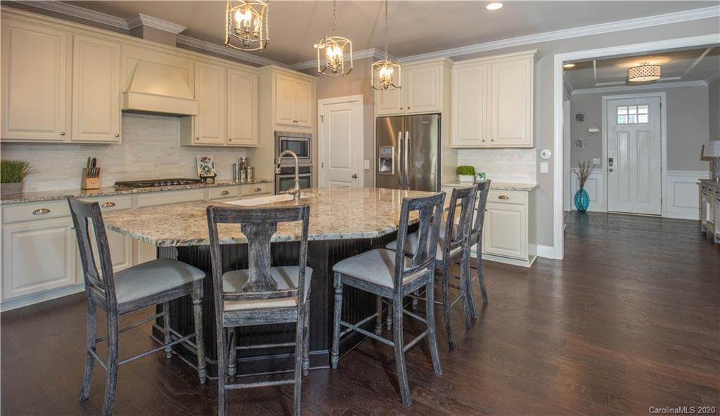 1026 Emory Lane Fort Mill, SC 29708 - Photo 7 of 41 a view of a dining room with furniture and wooden floor