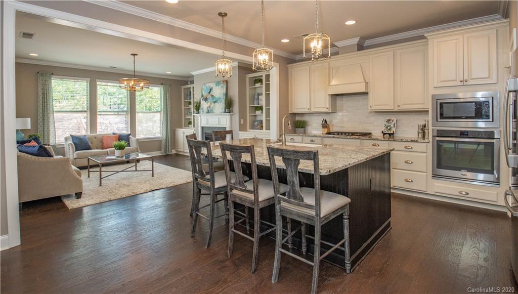 1026 Emory Lane Fort Mill, SC 29708 - Photo 8 of 41 a view of kitchen with granite countertop cabinets dining table and chairs