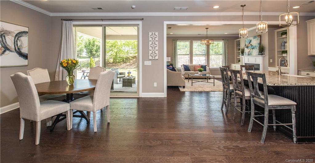 1026 Emory Lane Fort Mill, SC 29708 - Photo 9 of 41 a view of a dining room with furniture window and wooden floor