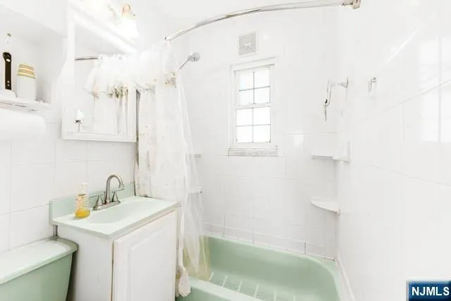 a view of front door with furniture and a window