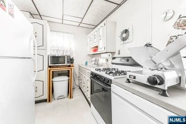 a living room with furniture and flat screen tv
