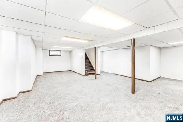 a view of a road with wooden fence