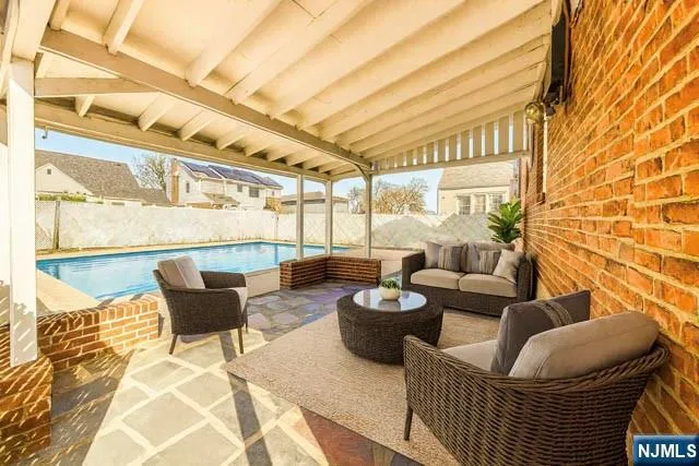 a outdoor living space with patio furniture and a potted plant