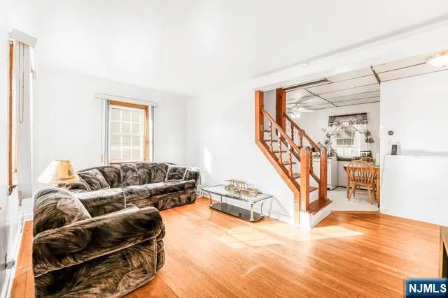 a bedroom with furniture and a wooden floor