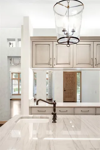 a bathroom with a sink a mirror and a shower