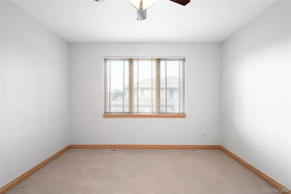 a bathroom with a sink and mirror with bathtub
