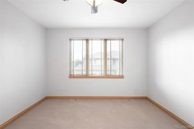 a bathroom with a sink and mirror with bathtub
