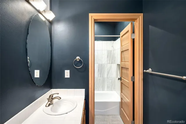 a view of a livingroom with a flat screen tv and a window