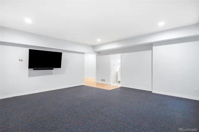 a bathroom with a sink a mirror and shower